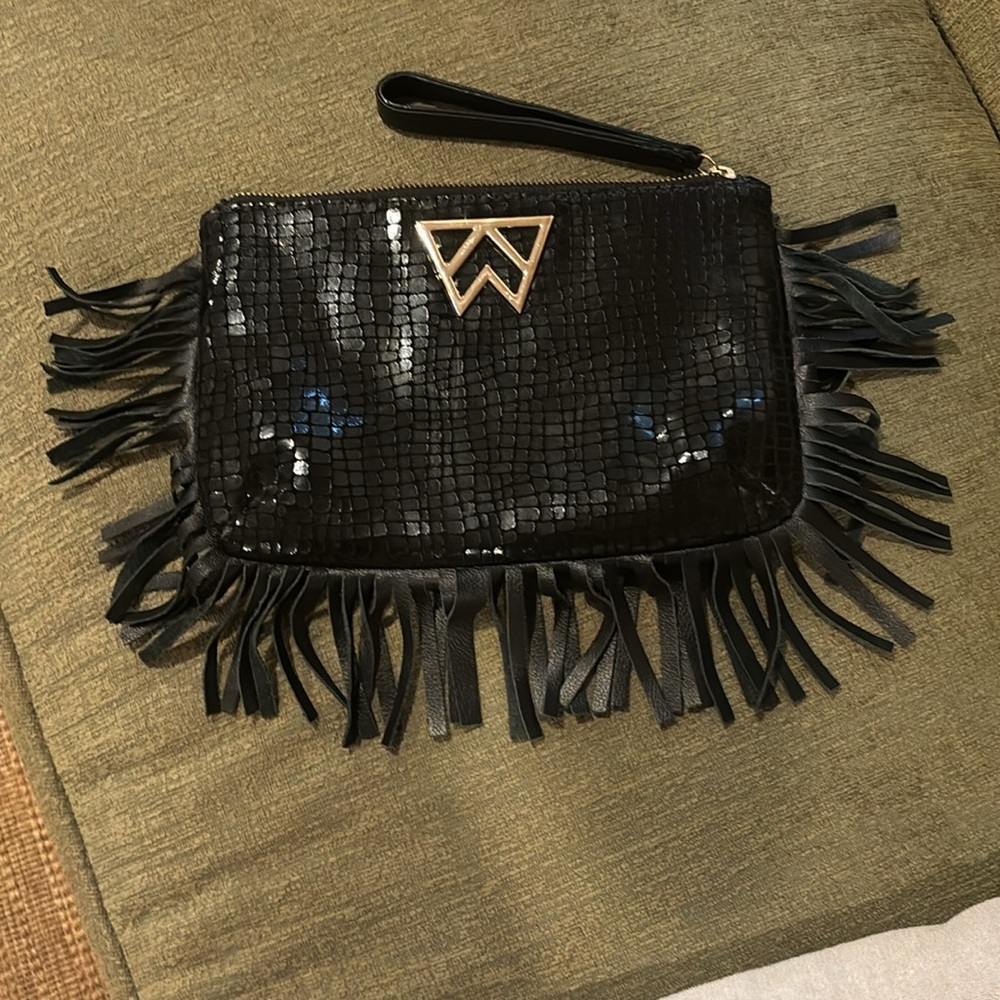 Kelly Wynne wristlet. Black snake skin with fringe.
